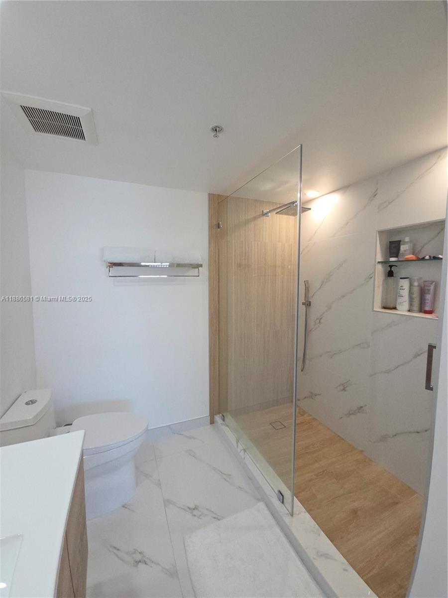 36 Northwest 6th Avenue, Unit TS9 Miami, FL 33128 - Photo 36 of 50 a bathroom with a shower and a sink