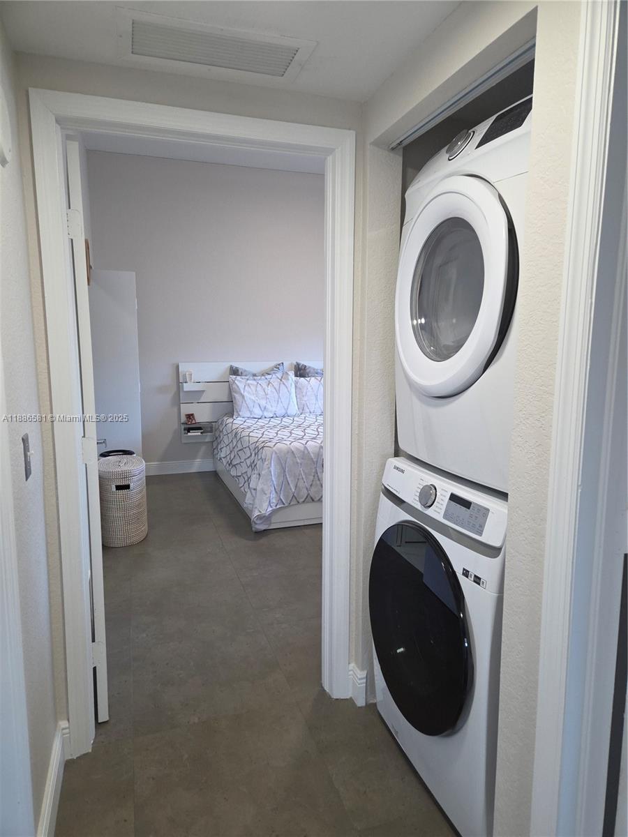 36 Northwest 6th Avenue, Unit TS9 Miami, FL 33128 - Photo 44 of 50 a utility room with dryer and washer