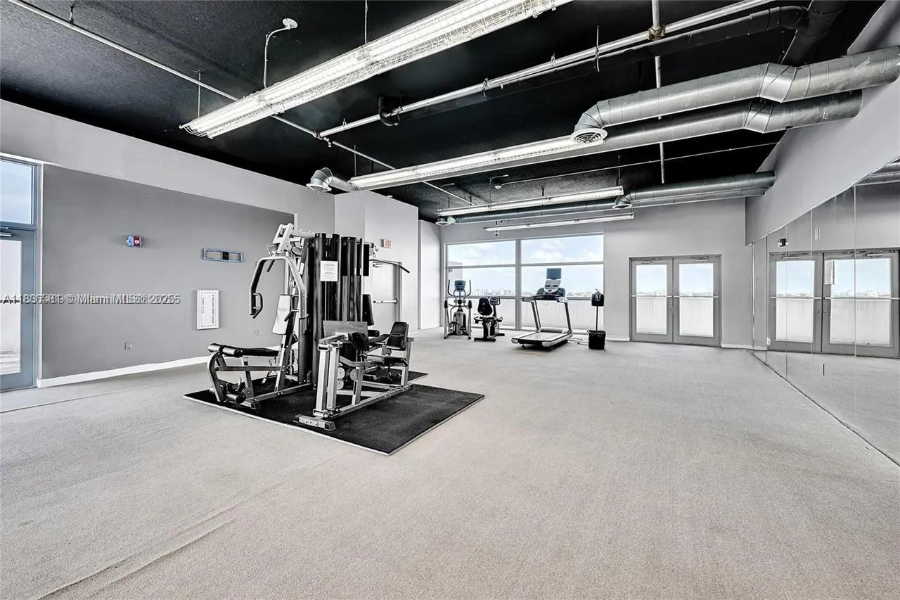 36 Northwest 6th Avenue, Unit TS9 Miami, FL 33128 - Photo 49 of 50 a view of a room with gym equipment