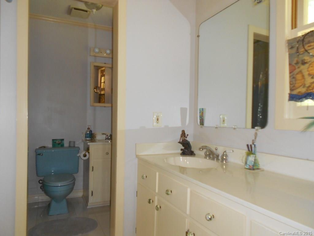 383 East Rebound Road Lancaster, SC 29720 - Photo 12 of 22 a bathroom with a toilet sink and mirror