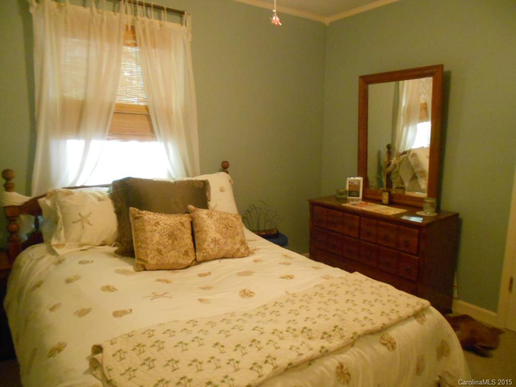 383 East Rebound Road Lancaster, SC 29720 - Photo 14 of 22 a bed sitting in a bedroom next to a window