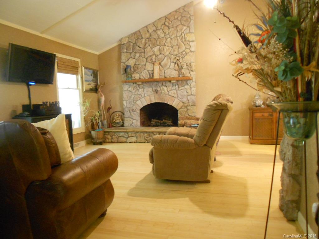 383 East Rebound Road Lancaster, SC 29720 - Photo 3 of 22 a living room with furniture and a fireplace