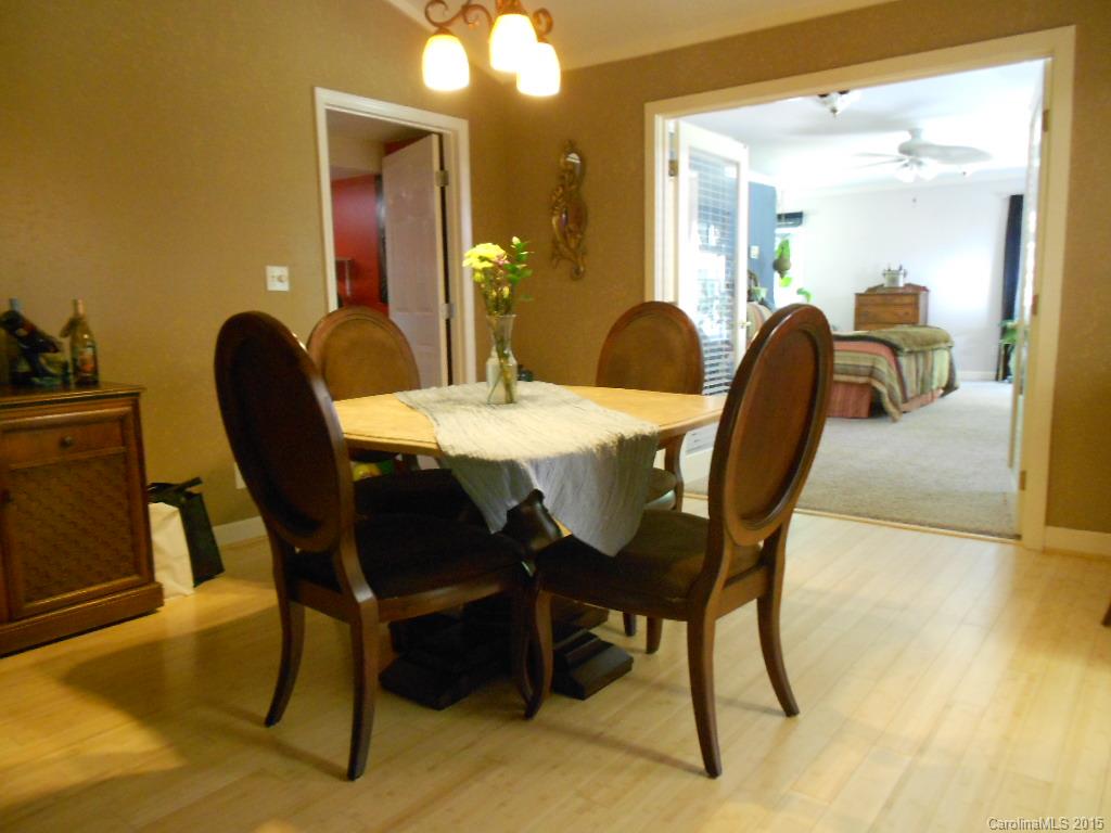 383 East Rebound Road Lancaster, SC 29720 - Photo 4 of 22 a dining room with furniture and wooden floor