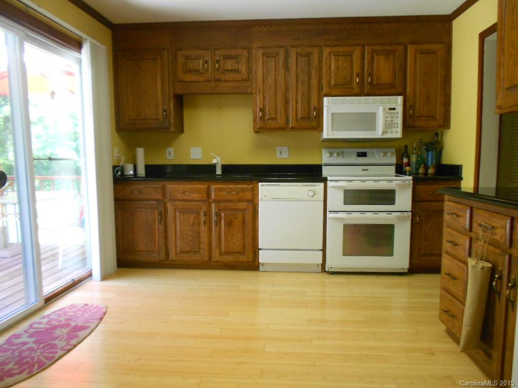 383 East Rebound Road Lancaster, SC 29720 - Photo 5 of 22 a kitchen with stainless steel appliances granite countertop a stove a sink and a microwave
