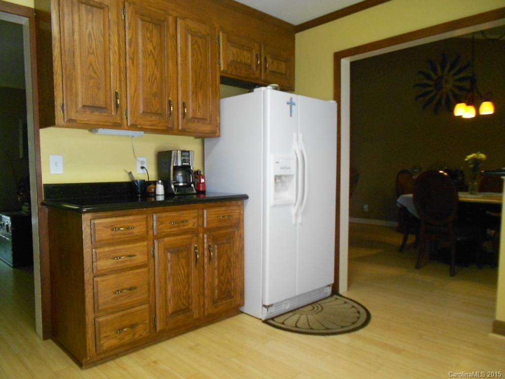 383 East Rebound Road Lancaster, SC 29720 - Photo 6 of 22 a kitchen with a refrigerator and cabinets