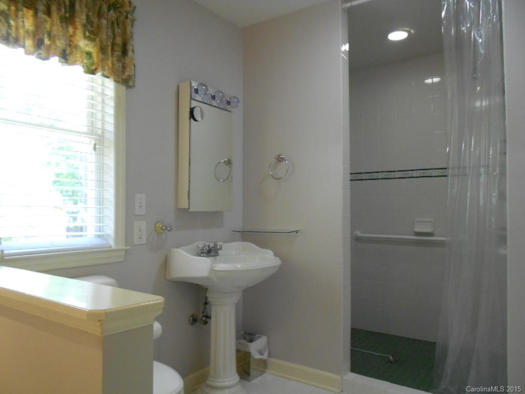 383 East Rebound Road Lancaster, SC 29720 - Photo 10 of 22 a bathroom with a sink toilet and shower