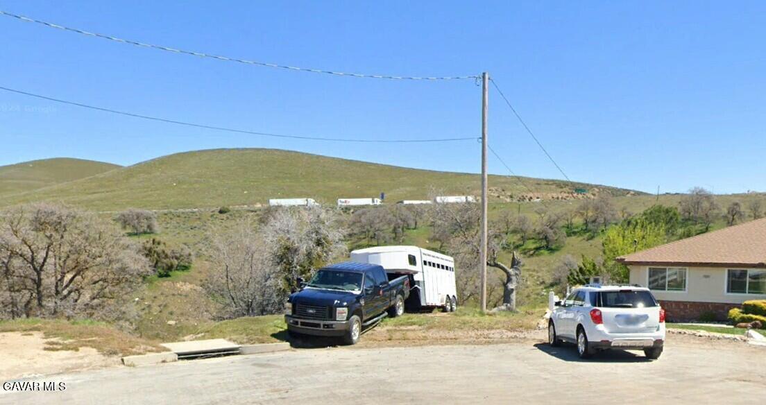 19300 Moon Drive Tehachapi, CA 93561 - Photo 2 of 13 a car parked on the side of the road