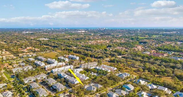 an aerial view of residential building with parking space