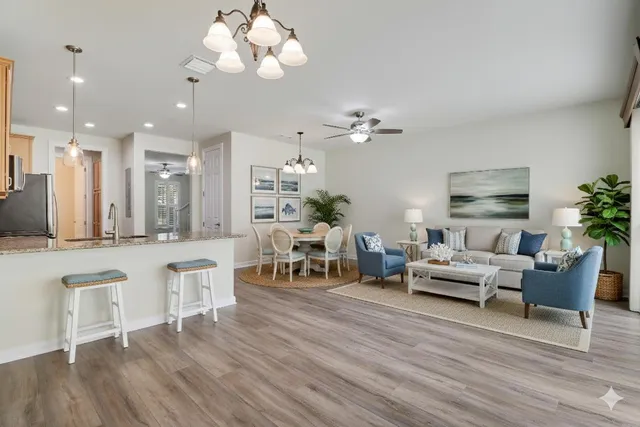 a living room with furniture and a chandelier