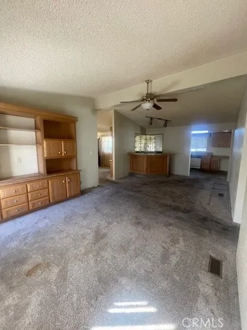 a kitchen with a refrigerator and a sink