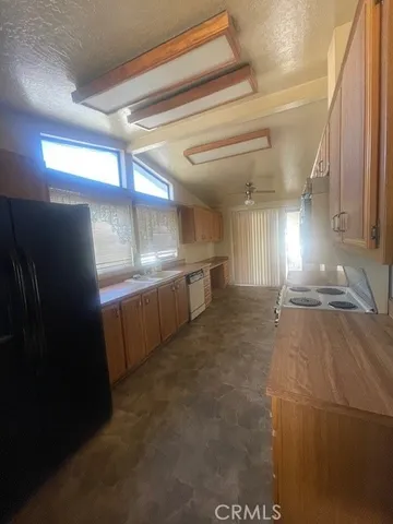 a view of a kitchen with storage and utility