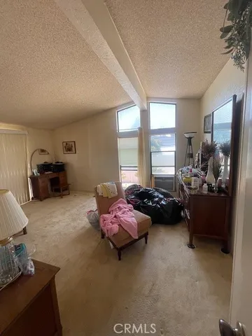 a bathroom with a granite countertop tub sink and mirror