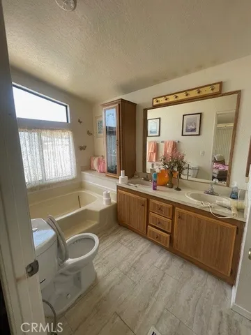 a bedroom with a bed and a night stand