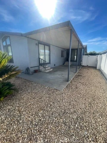 a patio with patio table and chairs