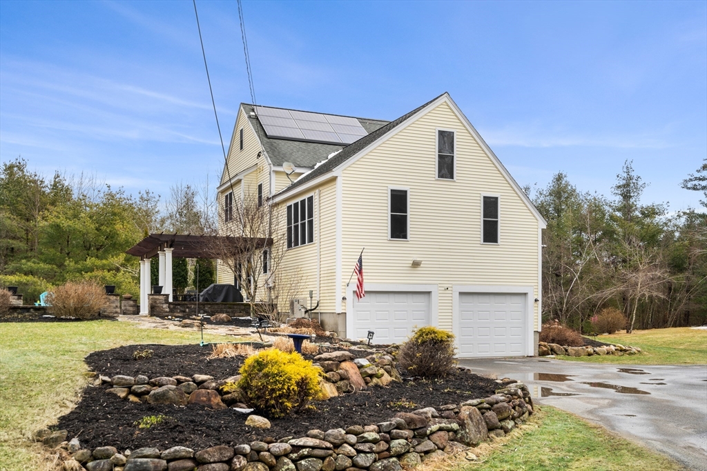 807 Mason Road Ashby, MA 01431 - Photo 3 of 40 a front view of a house with garden