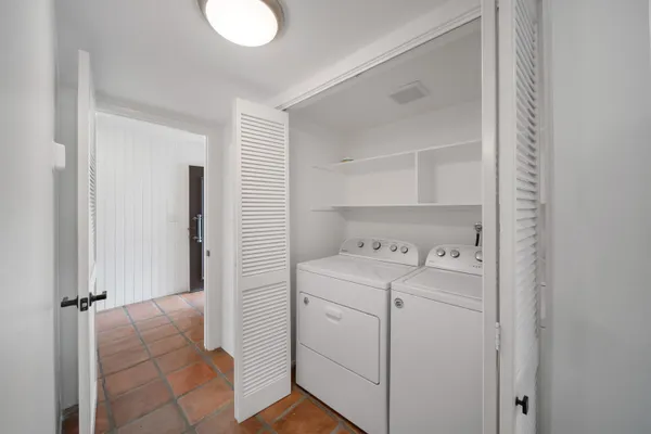 a view of bathroom with washer and dryer