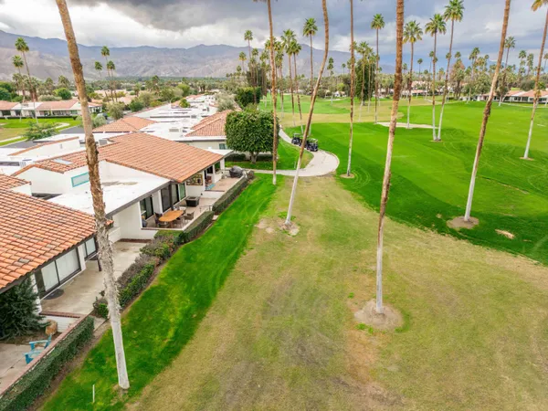 an aerial view of a house with a garden
