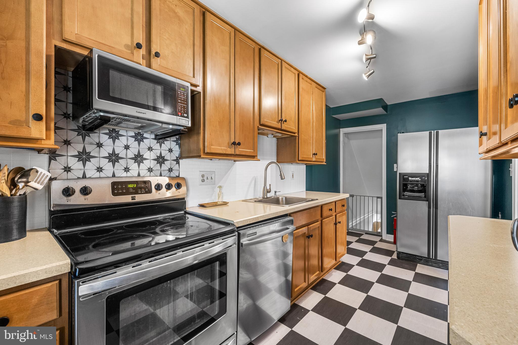 1620 Hardwick Road Towson, MD 21286 - Photo 13 of 38 a kitchen with stainless steel appliances granite countertop a stove a sink and a refrigerator