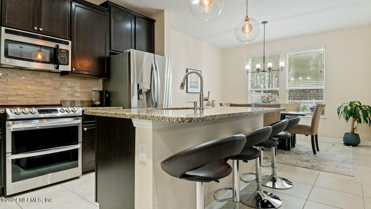 3842 Chasing Falls Road Orange Park, FL 32065 - Photo 11 of 33 Kitchen view towards eat-in area