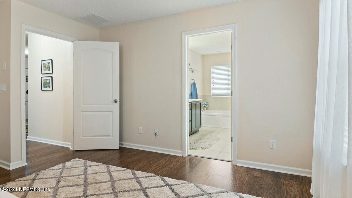 3842 Chasing Falls Road Orange Park, FL 32065 - Photo 24 of 33 Master bedroom view of door & bath