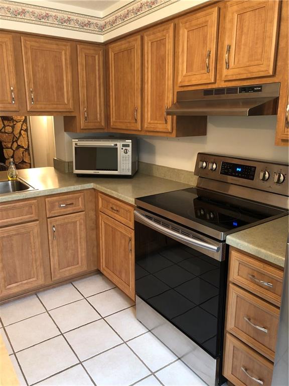 222 Shady Ridge Drive Monroeville, PA 15146 - Photo 7 of 17 Kitchen with updated cabinetry and microwave.