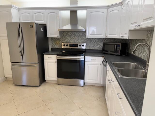 9256 Sable Ridge Circle, Unit D Boca Raton, FL 33428 - Photo 2 of 16 a kitchen with a refrigerator sink and stove