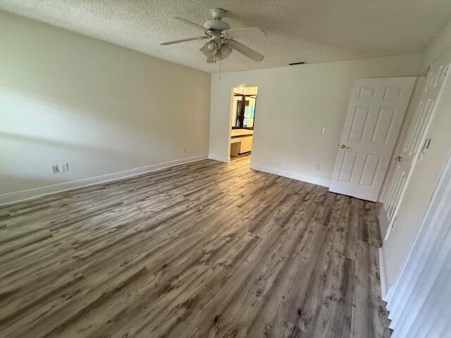 9256 Sable Ridge Circle, Unit D Boca Raton, FL 33428 - Photo 6 of 16 wooden floor in an empty room with a window