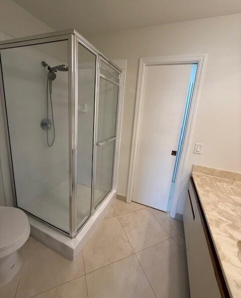 9256 Sable Ridge Circle, Unit D Boca Raton, FL 33428 - Photo 10 of 16 a bathroom with a granite countertop shower and a toilet