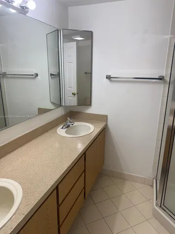 a bathroom with a sink and mirror