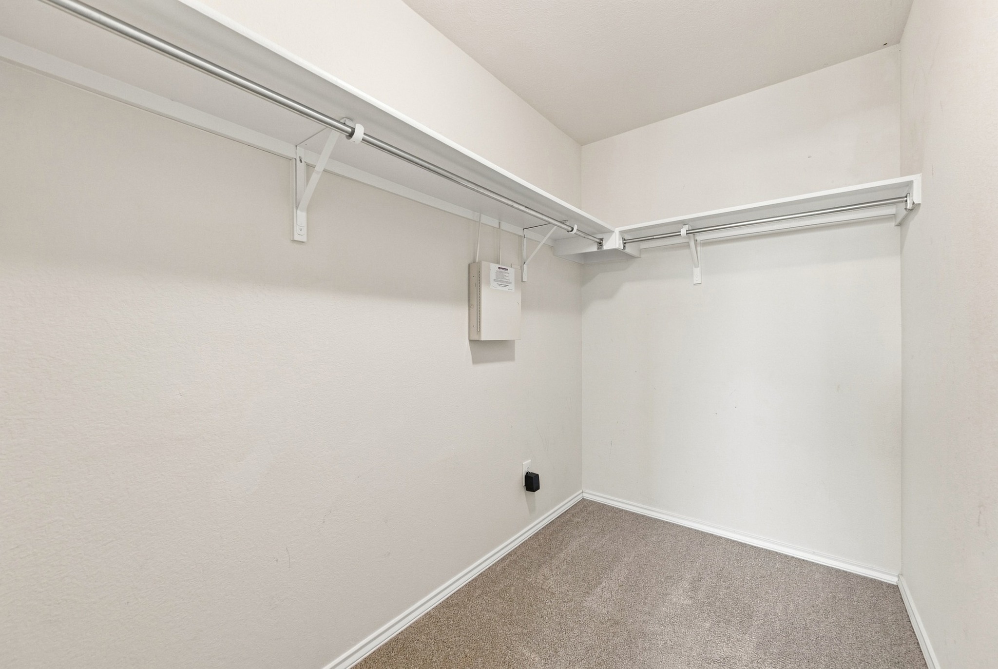 1141 Renaissance Trail Round Rock, TX 78665 - Photo 8 of 21 Ample built-in shelving and soft carpeting define this functional walk-in closet space.