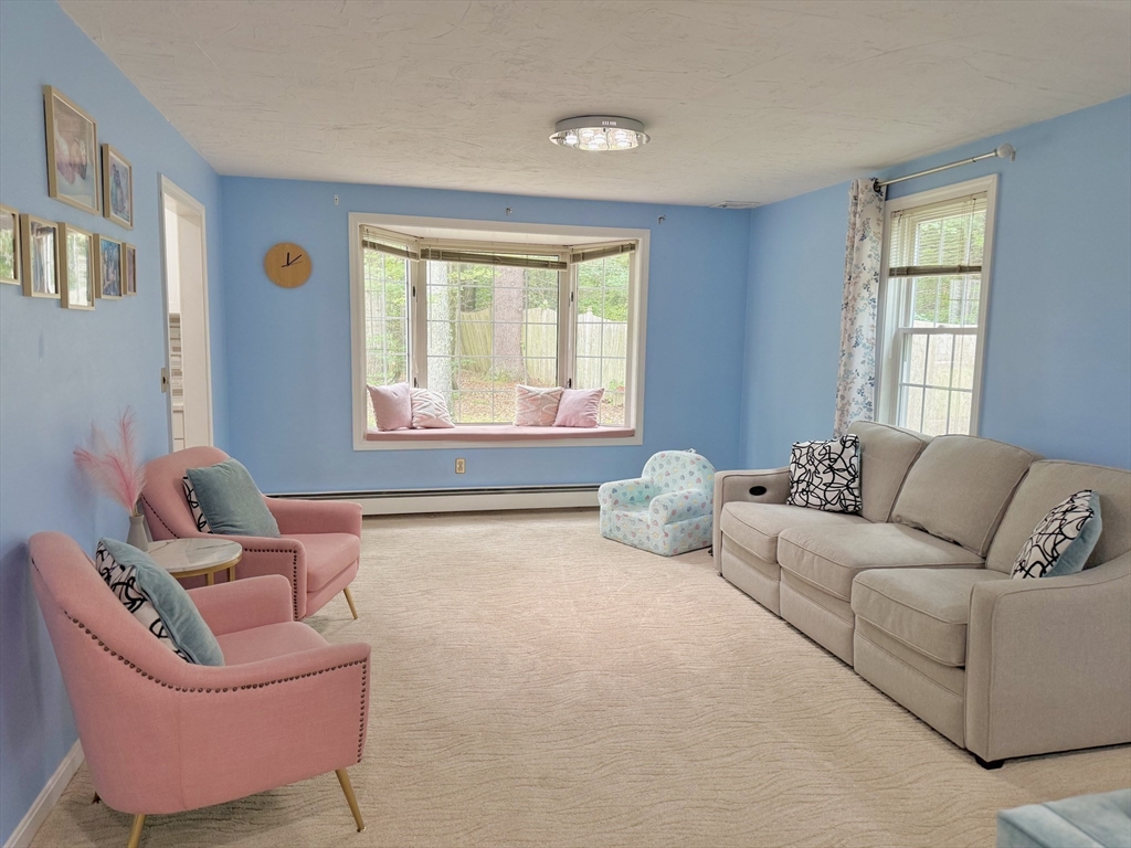 25 Homeward Lane, Unit 25 Natick, MA 01760 - Photo 3 of 16 a living room with furniture and a window