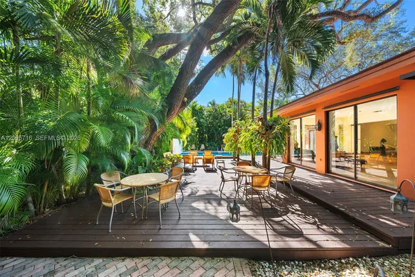 swimming pool view with a seating space