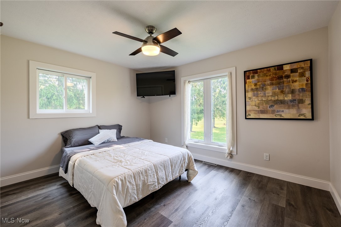 6268 Summers Road Windsor, OH 44099 - Photo 39 of 49 Spare Bedroom with baseboards, dark wood-style flooring, and ceiling fan