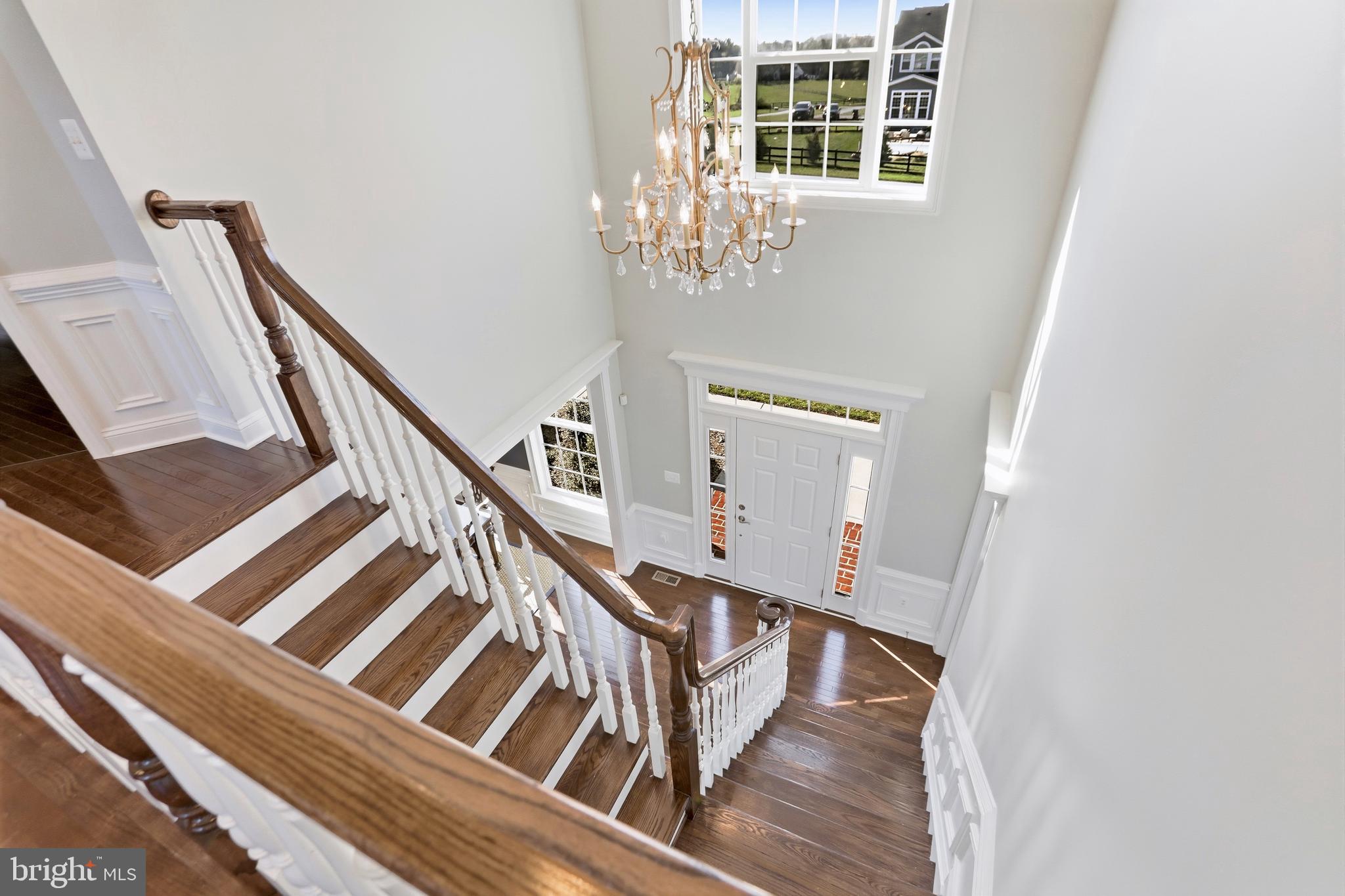 36972 Bridle Ridge Lane Purcellville, VA 20132 - Photo 5 of 44 a view of a balcony with wooden floor and stairs