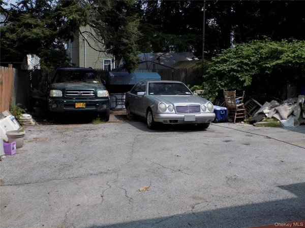 a view of street with parked cars