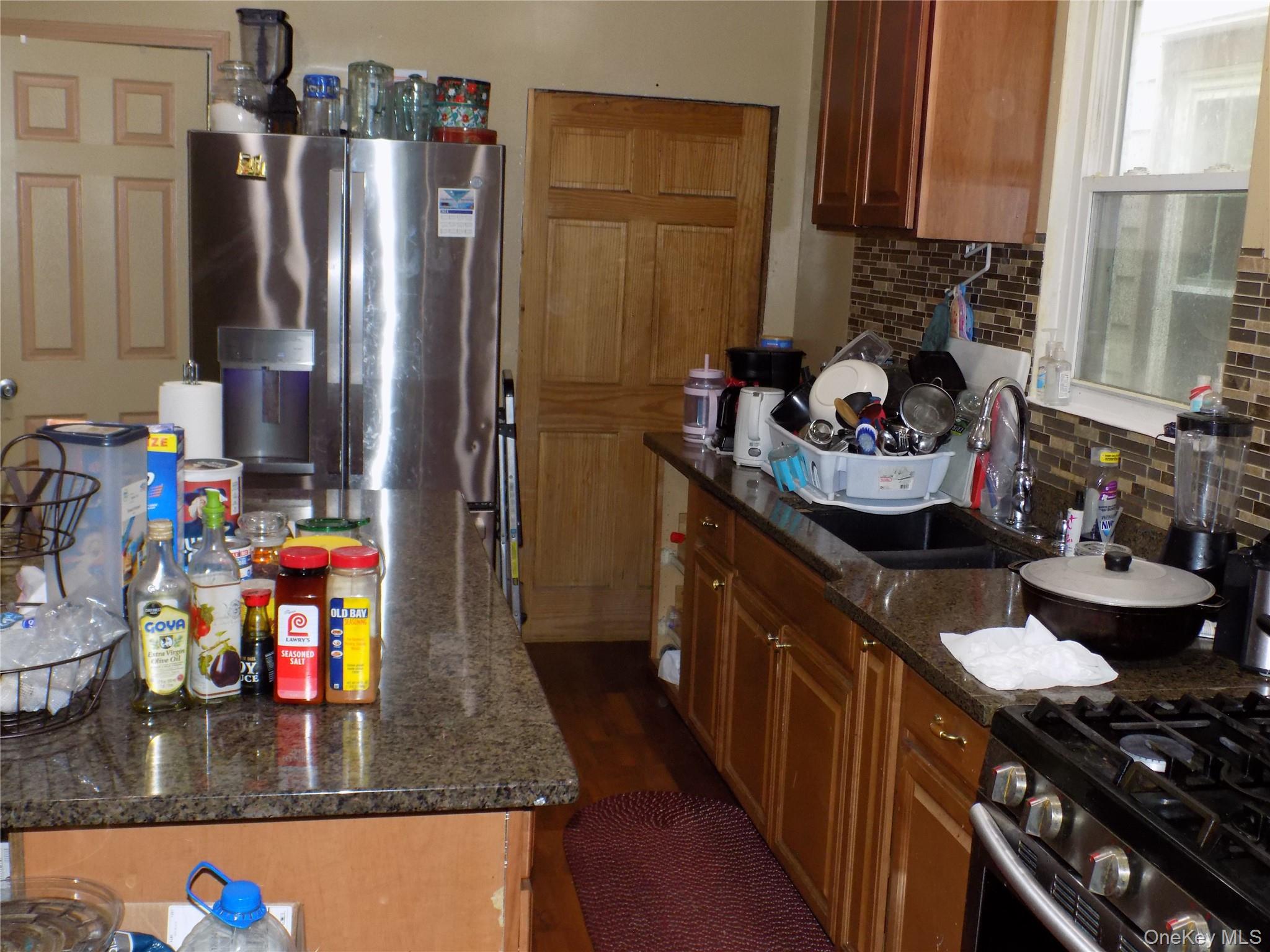 15 Thompson Street Poughkeepsie, NY 12601 - Photo 3 of 18 a kitchen with a refrigerator and a stove