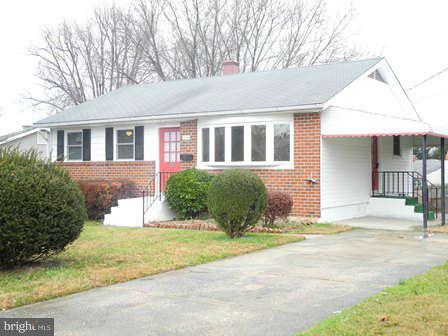 323 Leyton Road Reisterstown, MD 21136 - Photo 1 of 29 a front view of a house with a yard and potted plants