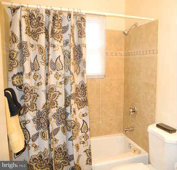 323 Leyton Road Reisterstown, MD 21136 - Photo 12 of 29 a bathroom with a bathtub and shower