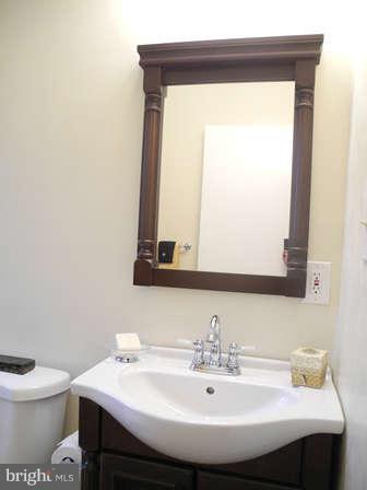 323 Leyton Road Reisterstown, MD 21136 - Photo 13 of 29 a bathroom with a sink and a toilet