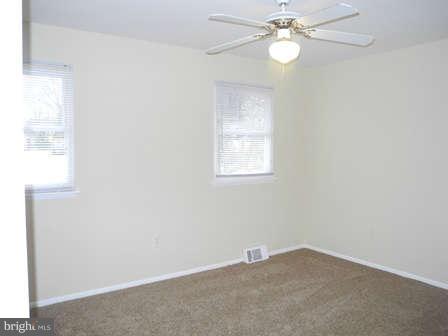 323 Leyton Road Reisterstown, MD 21136 - Photo 15 of 29 an empty room with windows and fan