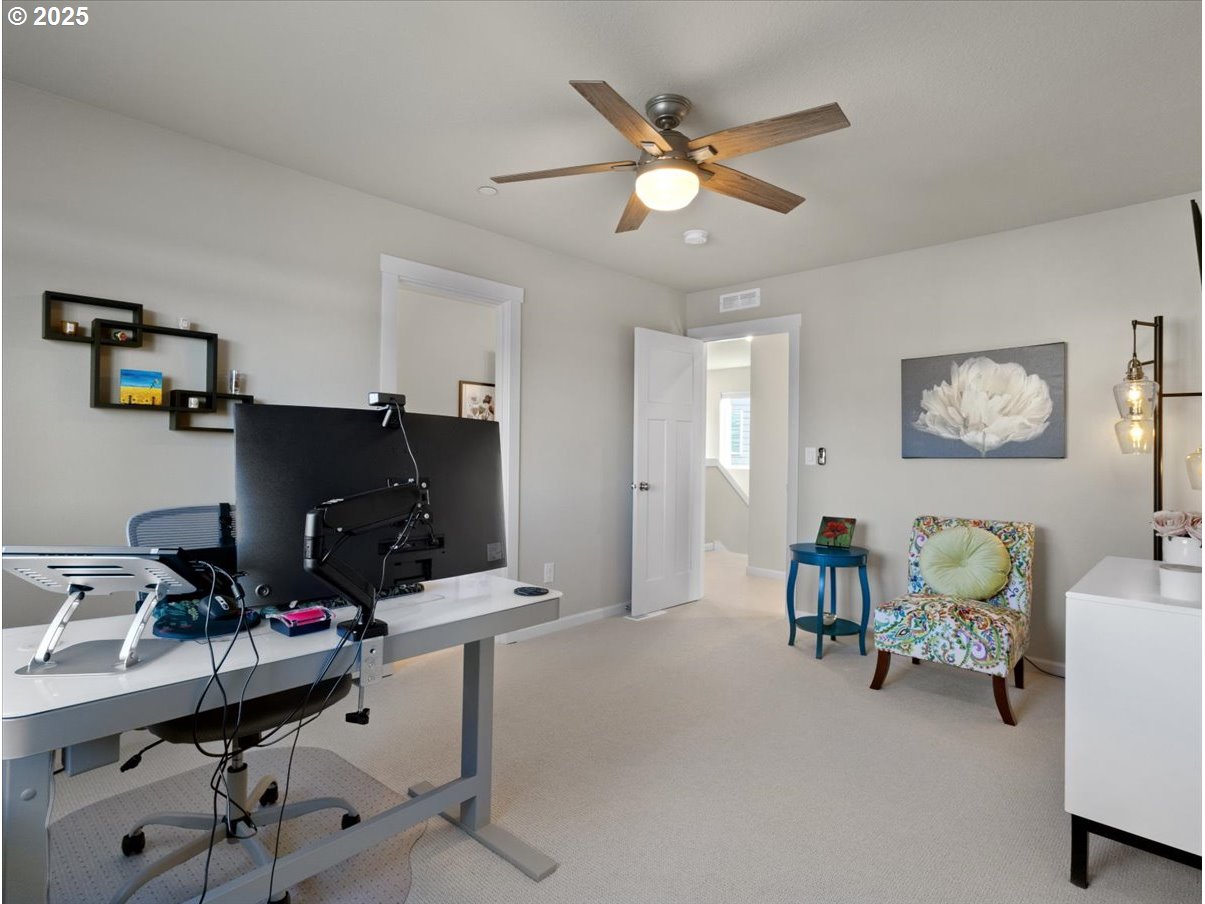 6684 North 89th Loop Camas, WA 98607 - Photo 23 of 44 a room with furniture and a window