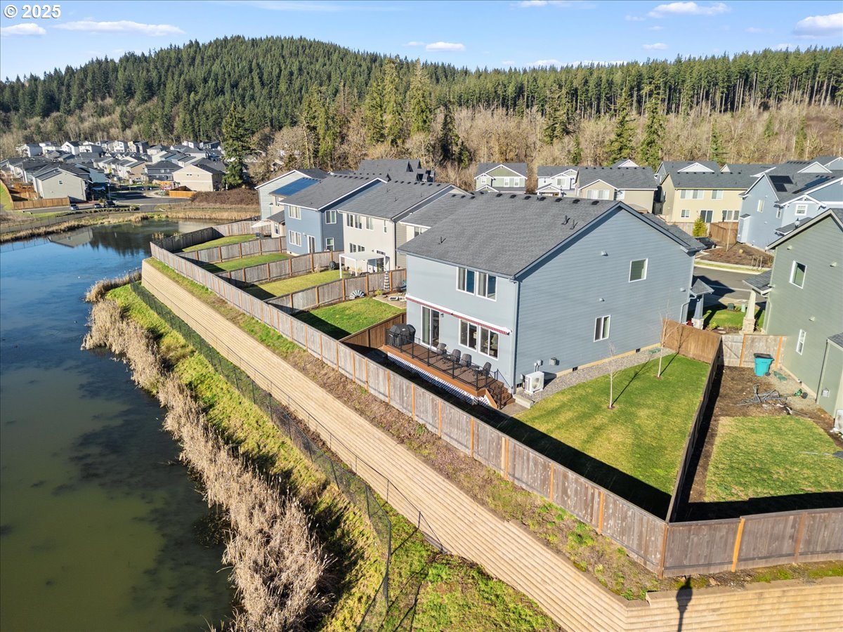 6684 North 89th Loop Camas, WA 98607 - Photo 36 of 44 a view of a swimming pool with a lake view