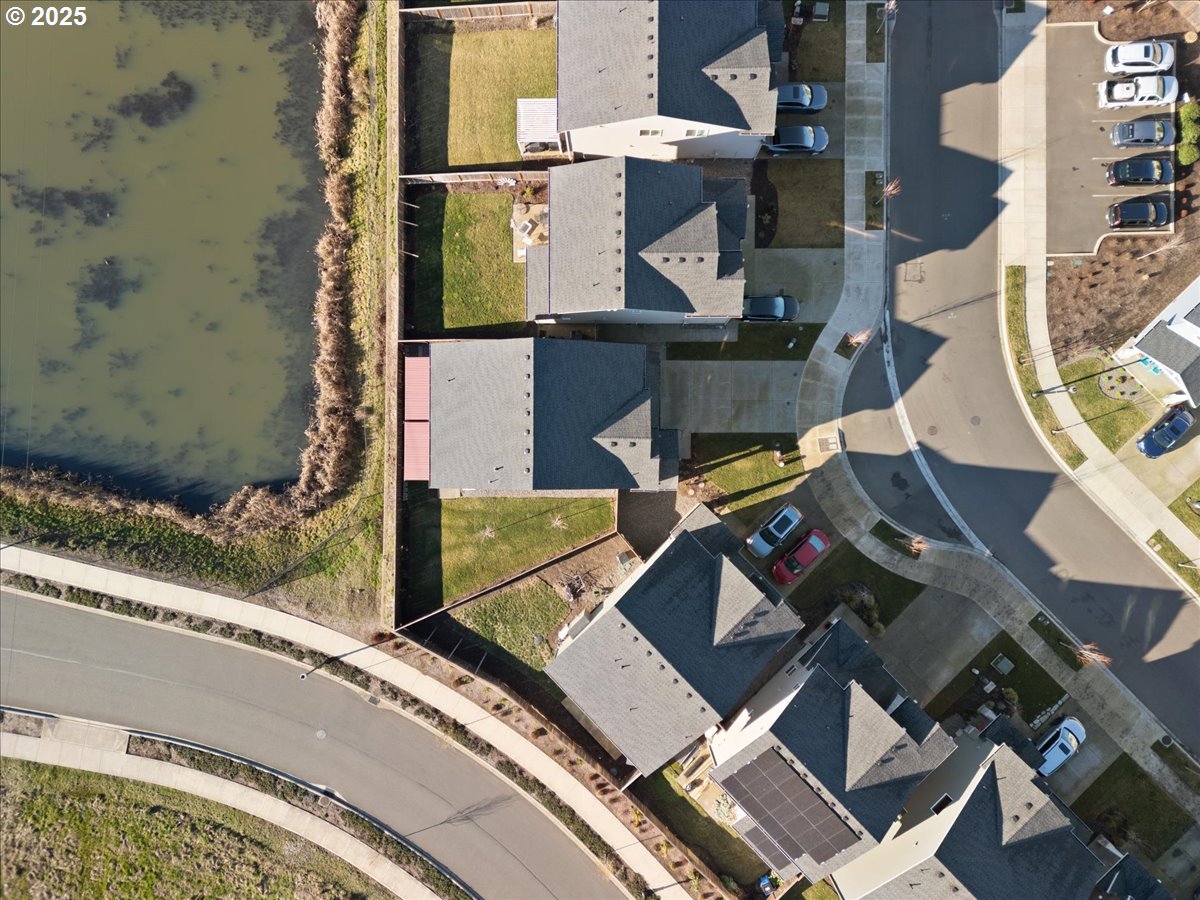 6684 North 89th Loop Camas, WA 98607 - Photo 41 of 44 an aerial view of a house with a garden and parking space