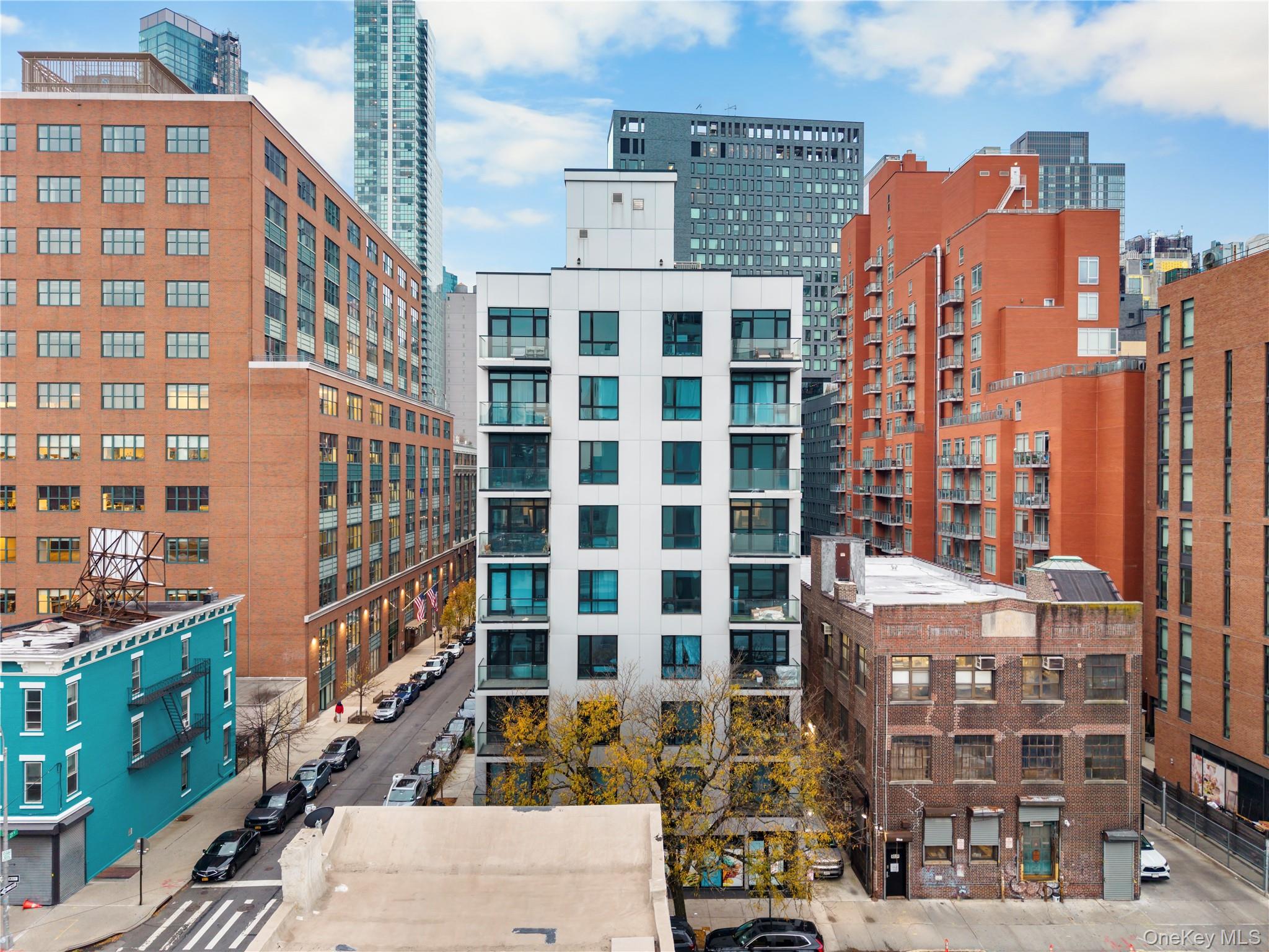 41-04 27th Street, Unit 7A Queens, NY 11101 - Photo 16 of 17 front view of a large building