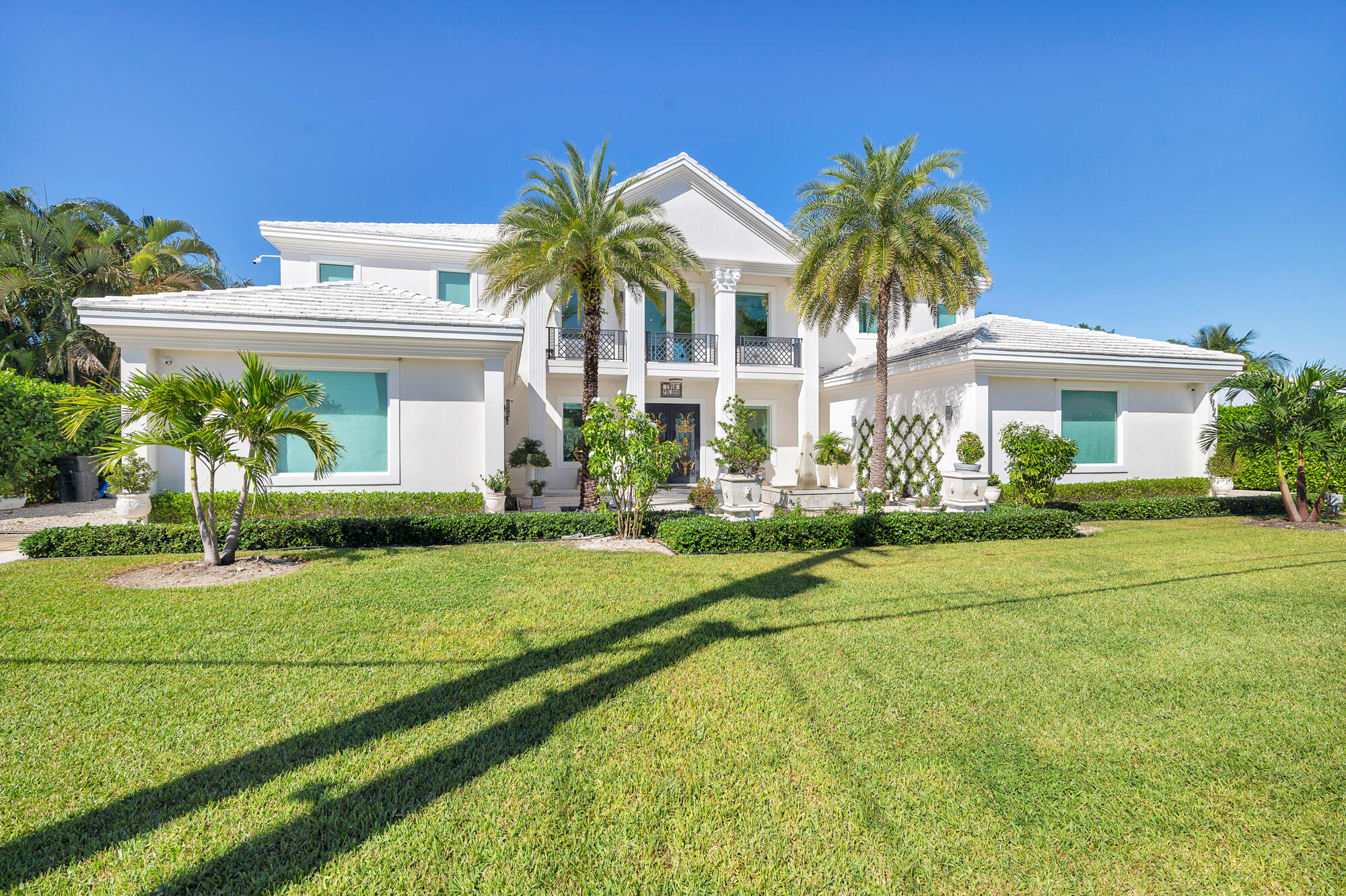 7923 Pine Tree Lane Lake Clarke Shores, FL 33406 - Photo 11 of 70 a front view of house with yard and green space
