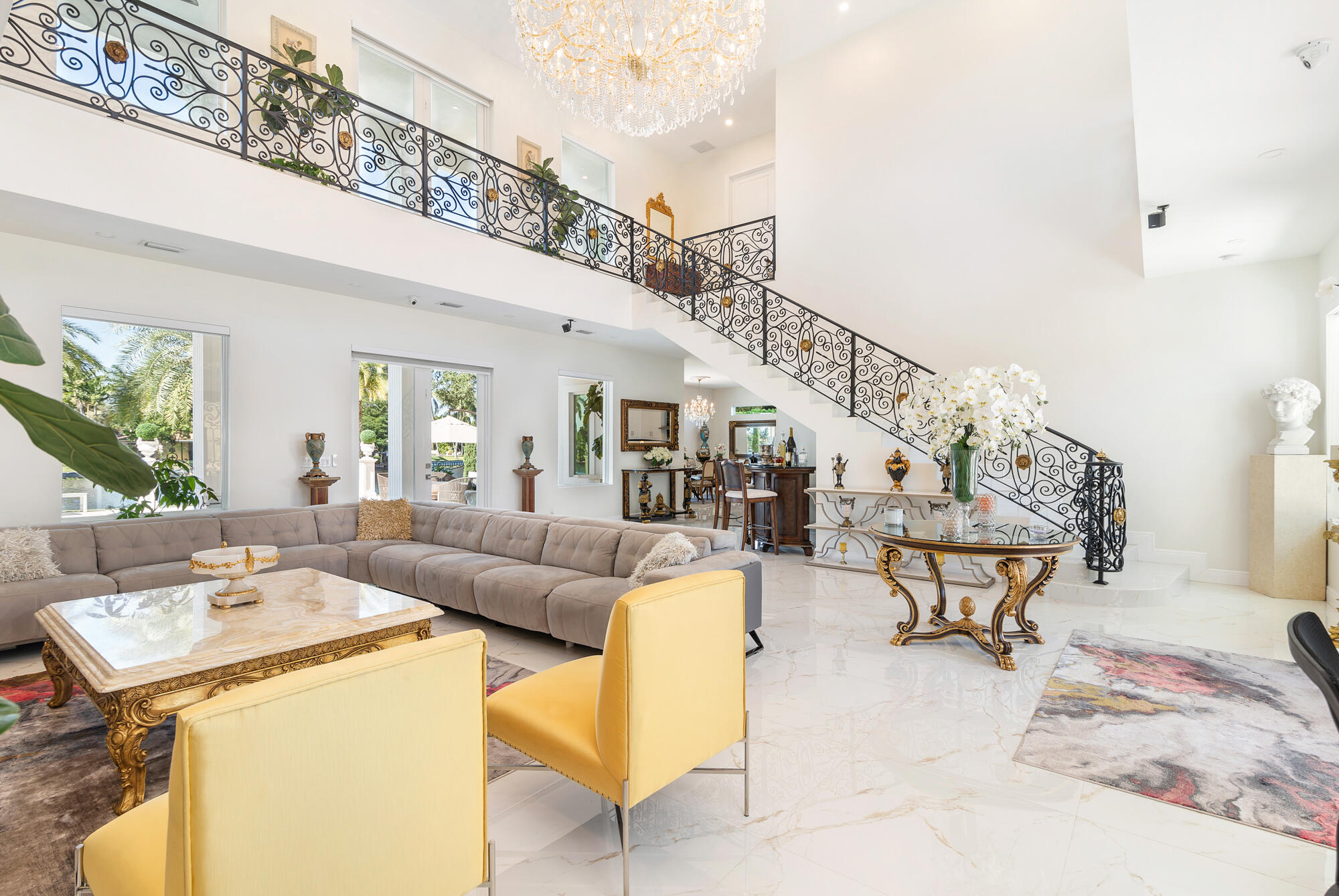 7923 Pine Tree Lane Lake Clarke Shores, FL 33406 - Photo 17 of 70 a living room with furniture and a chandelier