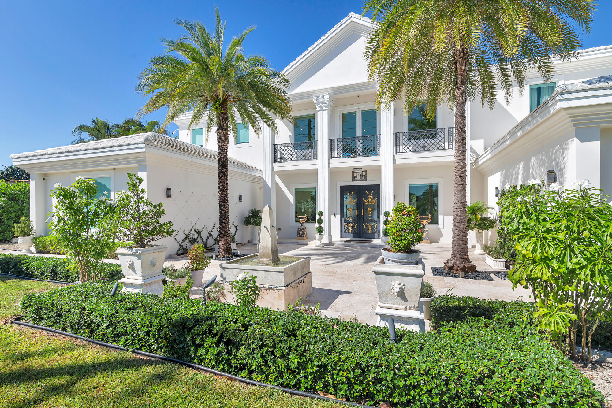 7923 Pine Tree Lane Lake Clarke Shores, FL 33406 - Photo 2 of 70 front view of a house with a yard