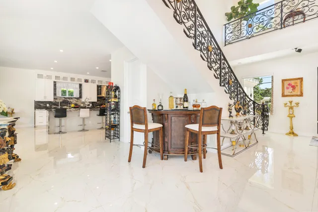 a bedroom with a large bed and a flat screen tv