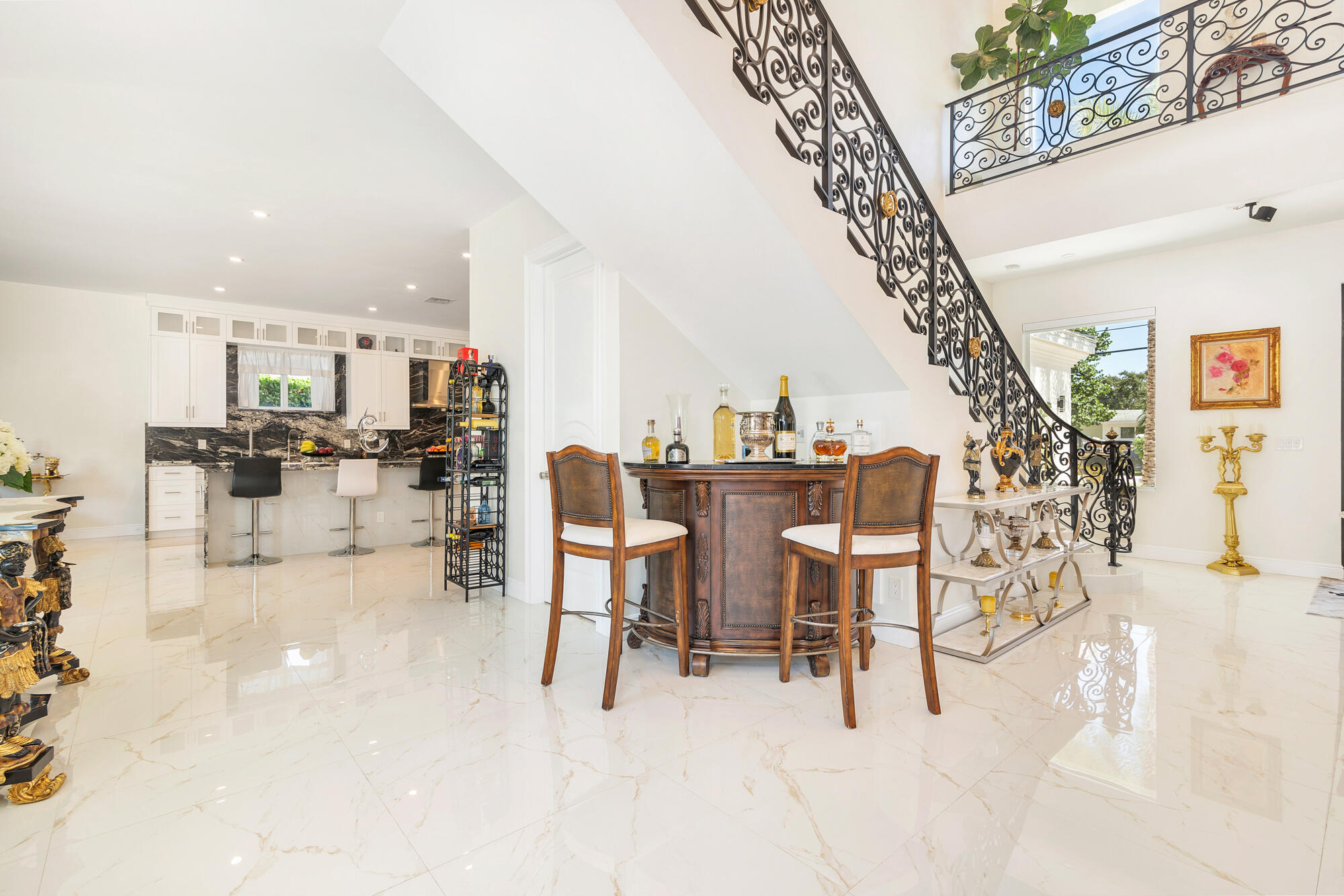 7923 Pine Tree Lane Lake Clarke Shores, FL 33406 - Photo 21 of 70 a dining room with furniture and a chandelier