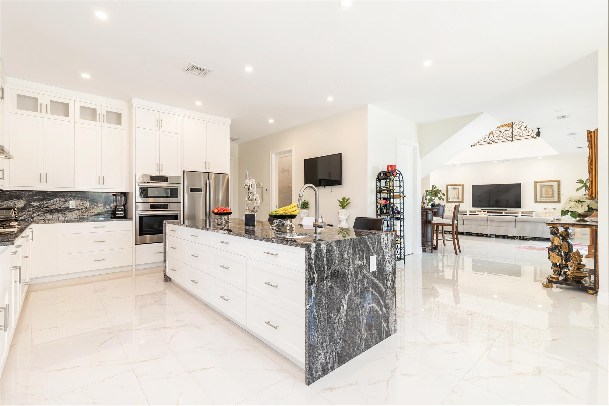7923 Pine Tree Lane Lake Clarke Shores, FL 33406 - Photo 24 of 70 a living room with furniture and a flat screen tv